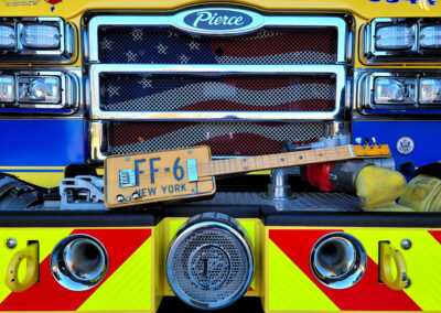 Cigar box guitar on fire engine